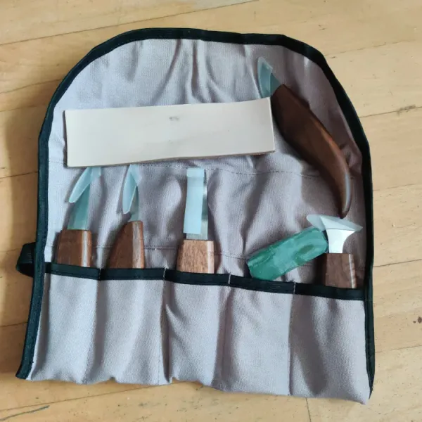 Verified buyer photo of the CarveKind kit unrolled, showing the strop and hook knife, submitted by a buyer in Denmark